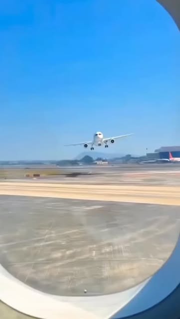 A plane landing at Sangster International seen from an aircraft window